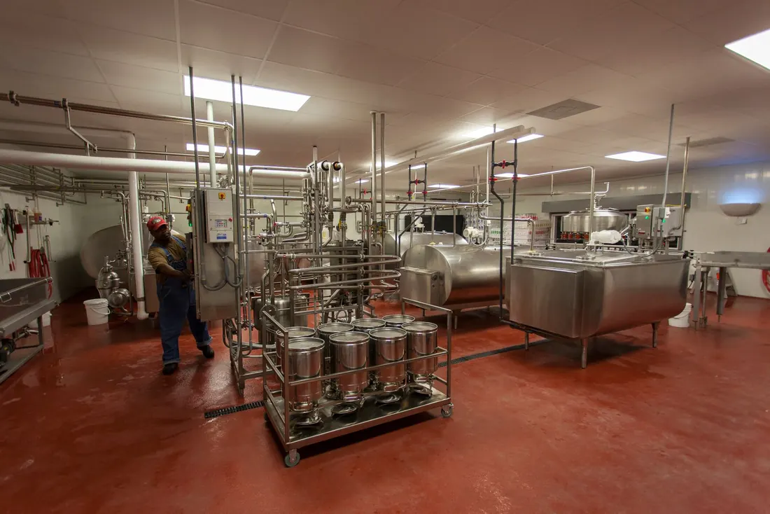 Stainless tanks and kegs in a food and beverage processing area