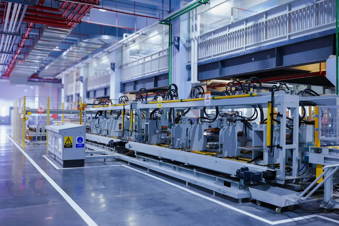 Machinery and interconnected production equipment inside a manufacturing plant